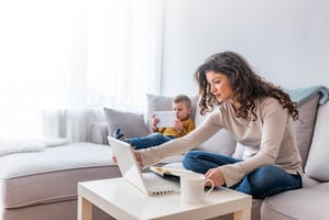 Woman looking at virtual home tour on computer