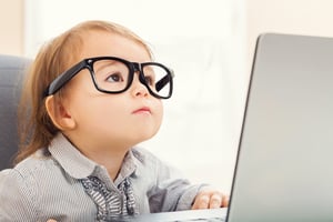 child looking at computer