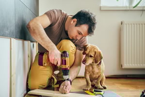 Man with drill renovating a home